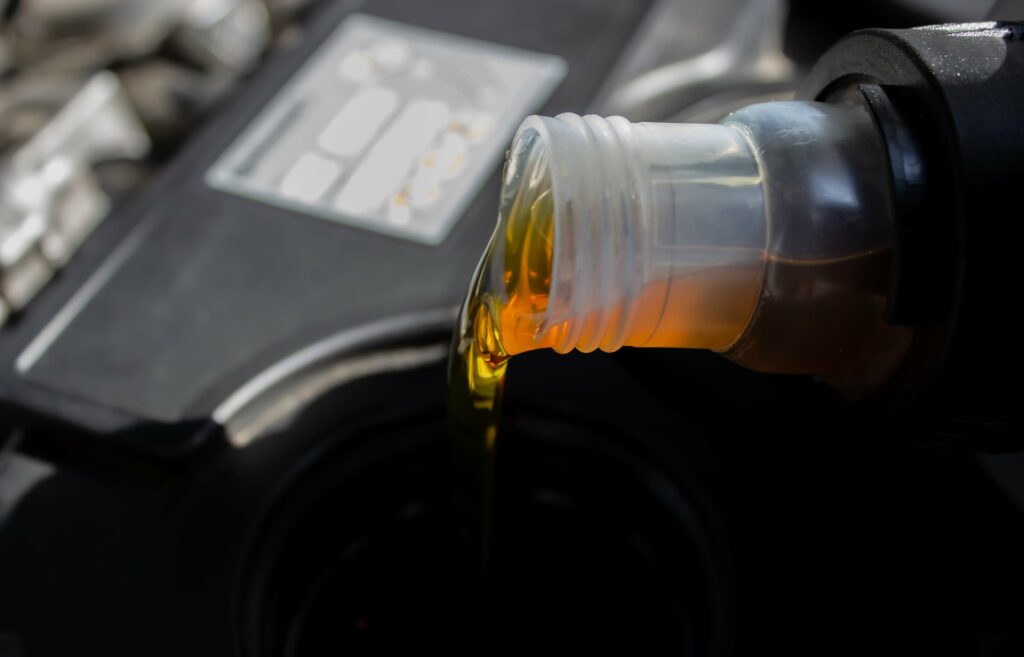 Changing the oil in an engine.