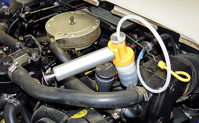 Closeup of engine oil meter.
