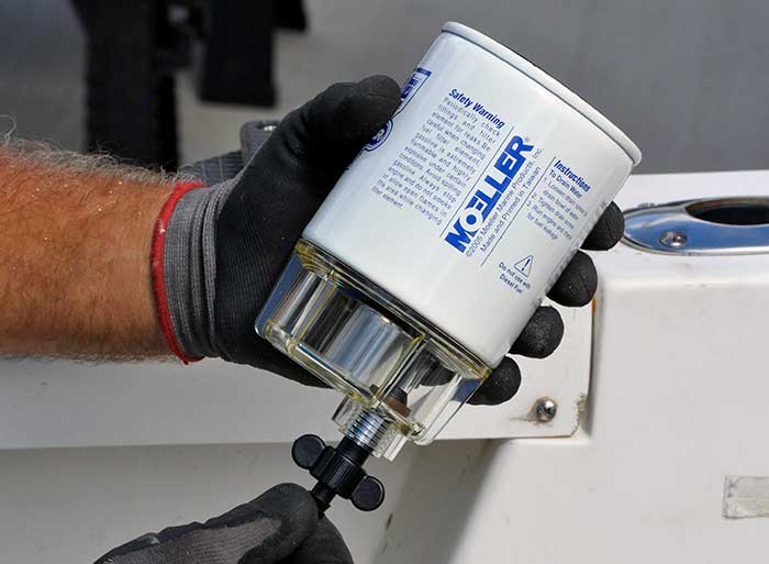 Installing a moeller fuel filter.