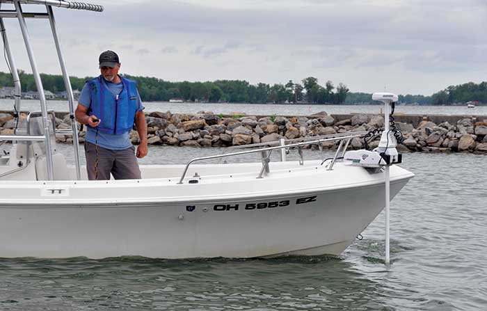 Boat with trolling motor mounted.